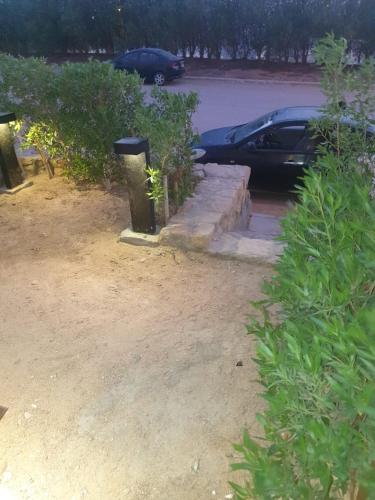 a car parked in a parking lot with a trash can at مكادى هايتس in Hurghada