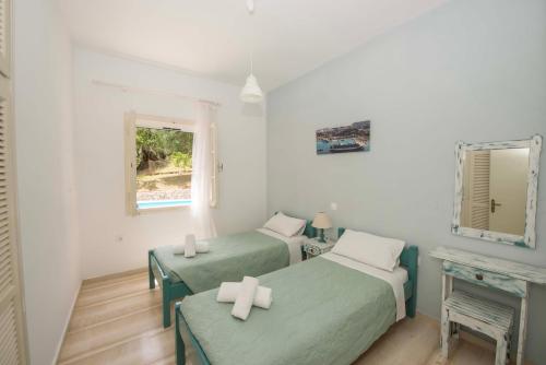 Ένα ή περισσότερα κρεβάτια σε δωμάτιο στο Villa Areti