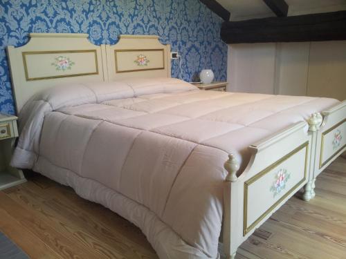Ένα ή περισσότερα κρεβάτια σε δωμάτιο στο B&B Casa Arcangeli