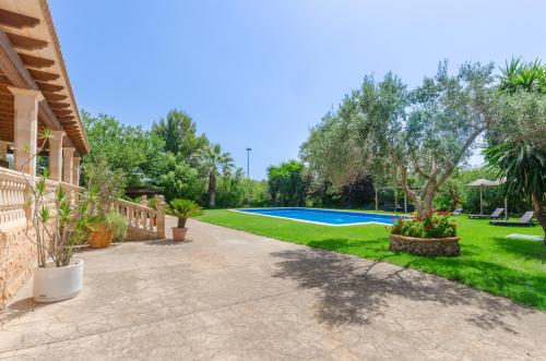 an image of a yard with a swimming pool at Can Berguins in Búger