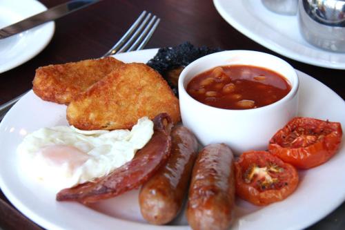 a plate of breakfast food with eggs sausage and beans at West Lodge Park in Barnet
