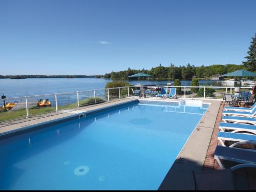 a large swimming pool with a view of the water at Glen House Resort in Lansdowne