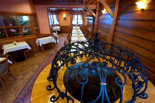 a dining room with a table in a restaurant at Hotel Karpatsky Dvor Lozorno in Lozorno