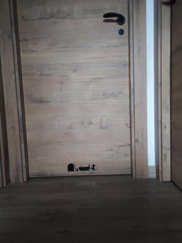 a door in a room with a wooden wall at Casa Min in Lasieso
