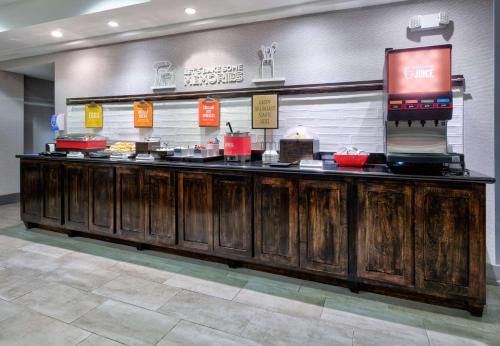 a buffet line in a restaurant with food at Hampton Inn Biloxi Beach Boulevard in Biloxi