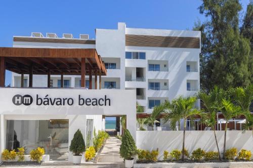 a building with a sign for a beach at HM Bavaro Beach - Adults Only in Punta Cana