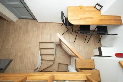an overhead view of a staircase in a room with wooden floors at LOFT Studio in Central Lisbon in Lisbon