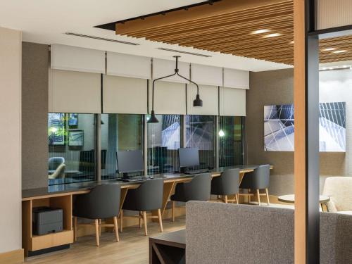 a conference room with a table and chairs at Hyatt Place Albany Downtown in Albany
