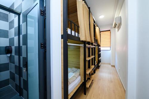 a hallway with bunk beds in a hostel at Van Hung in Ho Chi Minh City