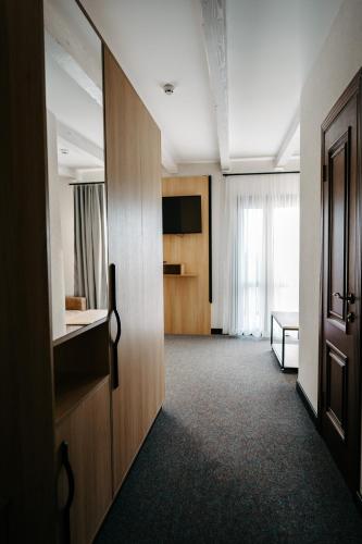 a room with a door and a room with a bed at SPA-Hotel Dodo in Zhytomyr