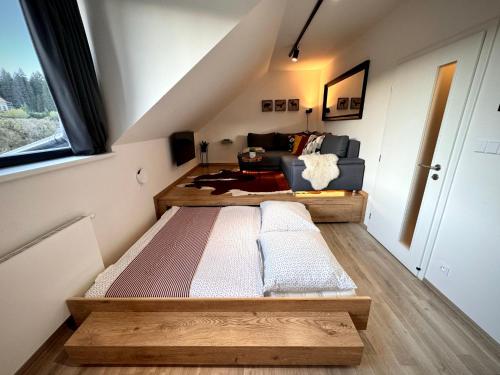 Postel nebo postele na pokoji v ubytování Horský apartmán Kvilda