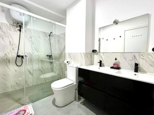a bathroom with a sink and a toilet and a shower at Animoss! Apartments - 10 modern apartments near city center & beach in Santa Maria