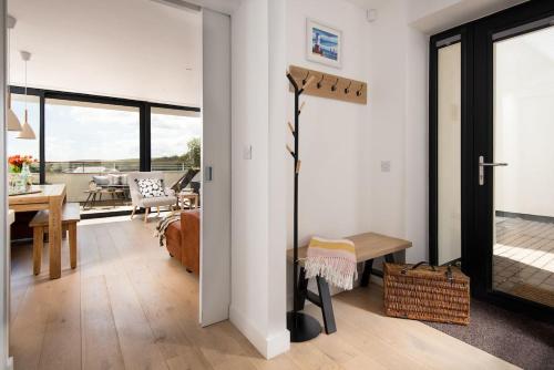 a living room with a view of a dining room at 6 The Bay in Coldingham