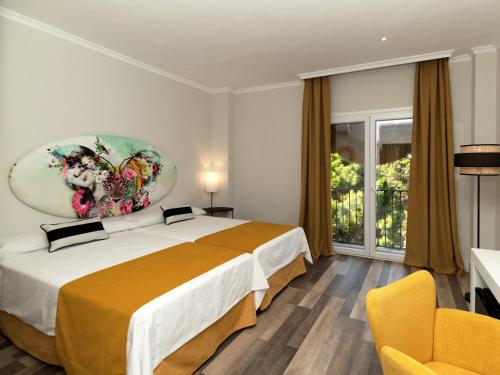 מיטה או מיטות בחדר ב-Hotel Altos de Istán