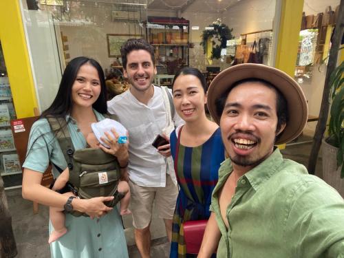 a group of people posing for a picture in a store at Notre Maison 5 Saigon close Walking street in Thao Dien D2 in Ho Chi Minh City