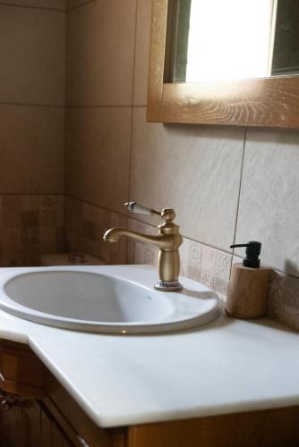 a bathroom sink with a faucet on top of it at Masia Casa Nova de n'Illa in Montseny