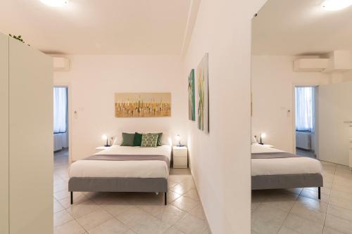 Letto o letti in una camera di Just Home Sant'Agostino
