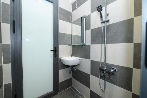 a bathroom with a sink and a shower at Van Hung in Ho Chi Minh City