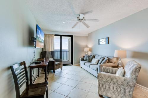 a living room with a couch and a table at Phoenix I 1085 in Orange Beach