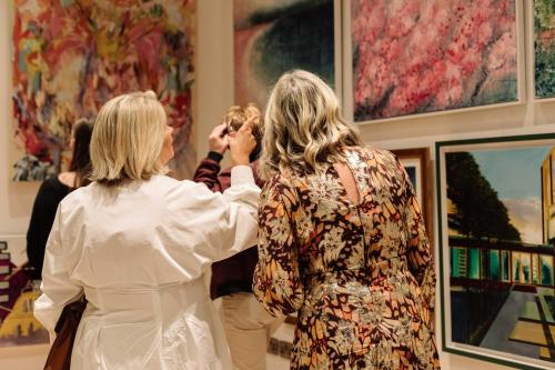 two women standing in a museum looking at art at room2 Belfast Hometel in Belfast