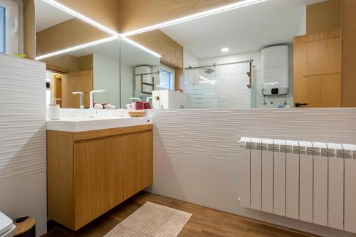 a bathroom with a sink and a mirror at 1-Bedroom Apartment with Balcony in Ledine