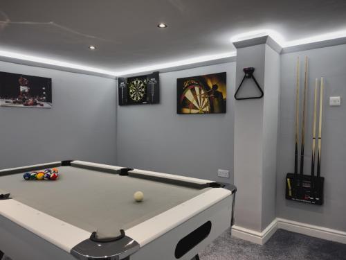 a billiard room with a pool table in it at Station House Haworth in Haworth