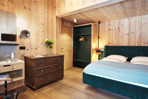 Voodi või voodid majutusasutuse AlpenLuxus' MOUNTAIN SUITE in the SportLodge with natural pool, whirlpool & sauna toas