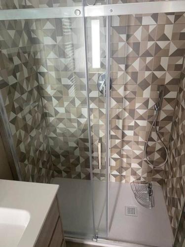 a shower with a glass door in a bathroom at Camera Quadrupla Civitanova Marche in Civitanova Marche