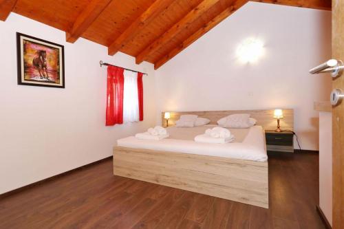 Ένα ή περισσότερα κρεβάτια σε δωμάτιο στο Villa Tereza