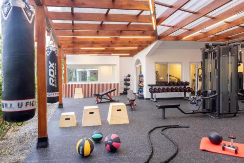 a gym with balls and equipment in a room at Hotel HM Alma de Bayahibe - Adults Only - All Inclusive in Bayahibe