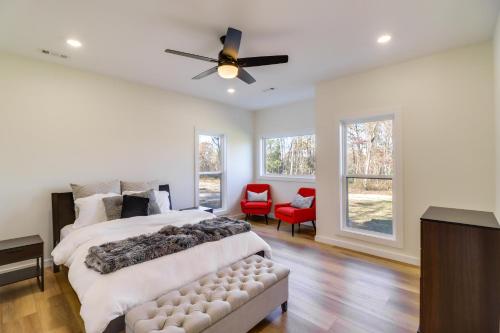 a bedroom with a large bed and a ceiling fan at Gorgeous Harrison Getaway with Patio and Kayak! in Harrison
