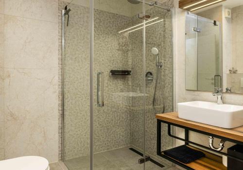 a bathroom with a shower and a sink at Villa More in Krk