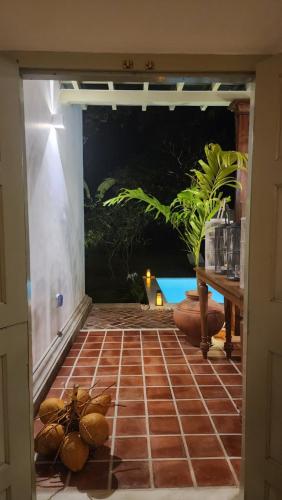 a door into a room with a tile floor at Sukomala Imaduwa in Ahangama