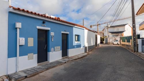 a blue building on the side of a street at Noah's Ark by LovelyStay in Cascais