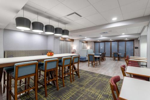 a large waiting room with tables and chairs at Hampton Inn Monticello, Ny in Monticello