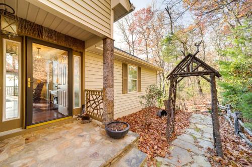 a front porch of a house with a patio at Cabin with Mountain Views Near Cashiers and Highlands in Sapphire