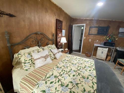 a bedroom with a large bed in a room at Hilda's Garage~Bandera, TX. in Bandera