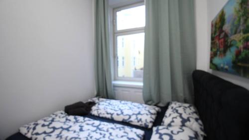 a bedroom with a bed and a window at Modern Double room JS in Vienna