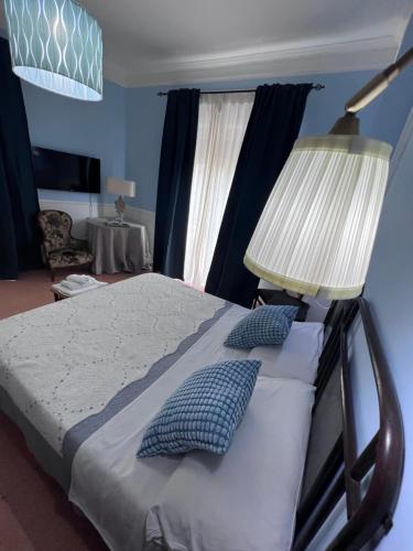 Ein Bett oder Betten in einem Zimmer der Unterkunft La Stazione di Posta