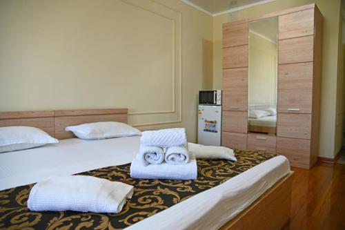 Postel nebo postele na pokoji v ubytování Апартаменты в центре Алматы, ЖК Молодежный