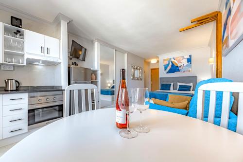 a bottle of wine sitting on a table in a kitchen at Lovely apartment Lavaggi sea view in Puerto de la Cruz