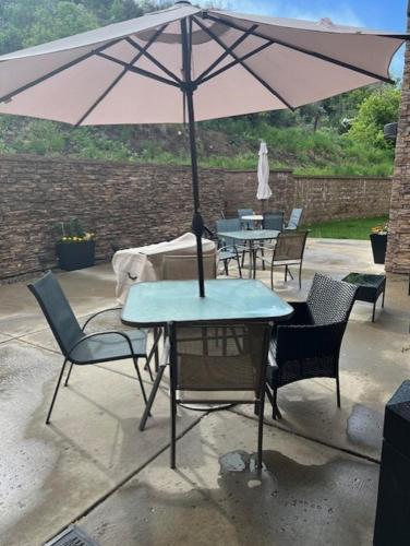 a table and chairs with an umbrella on a patio at Fairfield Inn & Suites by Marriott Durango in Durango