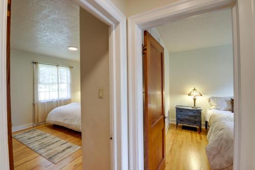 a bedroom with a bed and a dresser and a window at Charming Hamilton Hideaway Half-Mi to Main St! in Hamilton