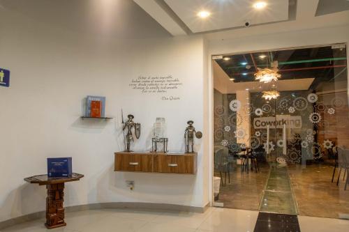 a room with two mannequins on display in a museum at Hotel Wess in Bogotá