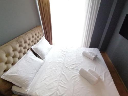 מיטה או מיטות בחדר ב-ISANI Lux Apartments