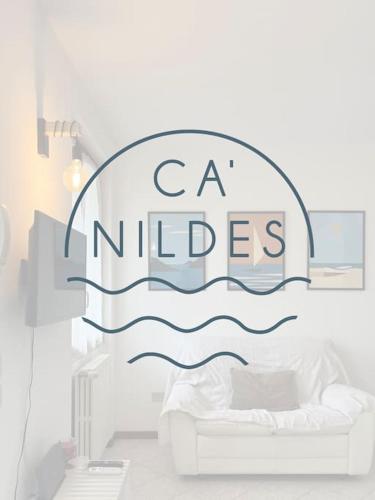 un dormitorio con un cartel que diga ca niles en Ca' Nildes, en Clusane sul Lago