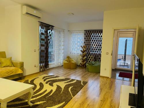a living room with a zebra print rug at Fron's Apartment in Pristina