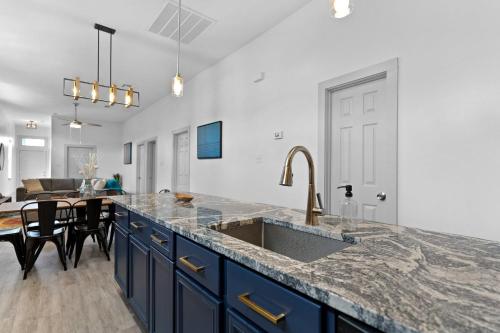 a kitchen with a sink and a counter top at House Of Vibes in New Orleans