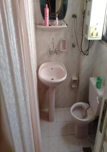a small bathroom with a sink and a toilet at Alexandria,Egypt in Alexandria