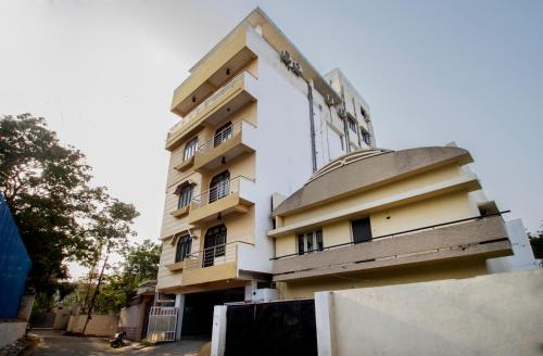 a building with balconies on the side of it at Collection O Hotel Park Heights Banjara Hills Near Gvk One Mall in Hyderabad